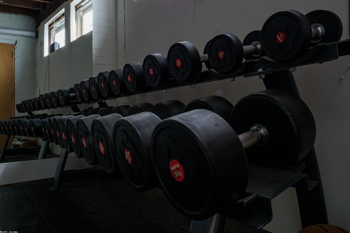 Weight training area with racks and plates